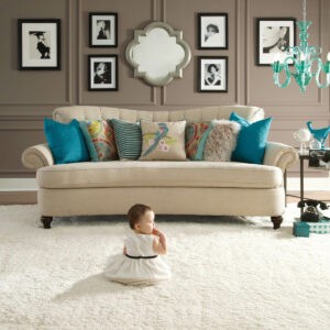 Cute baby sitting on carpet | Stevens Floor Coverings