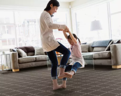 Happy mom and girl doing fun | Stevens Floor Coverings