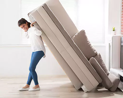 Woman Sofa moving | Stevens Floor Coverings